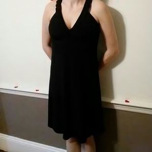 Black knee length dress. V-neck. Lace detail